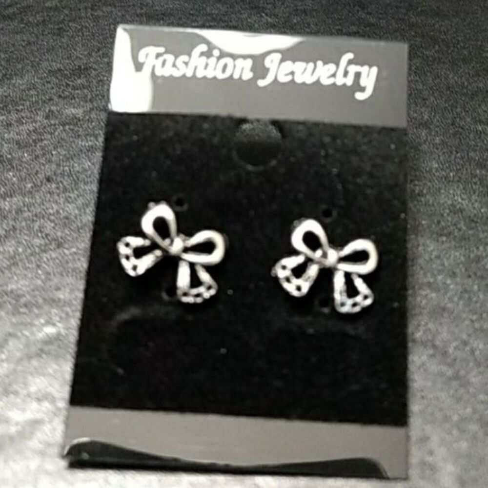 Silver tone bow stud earrings